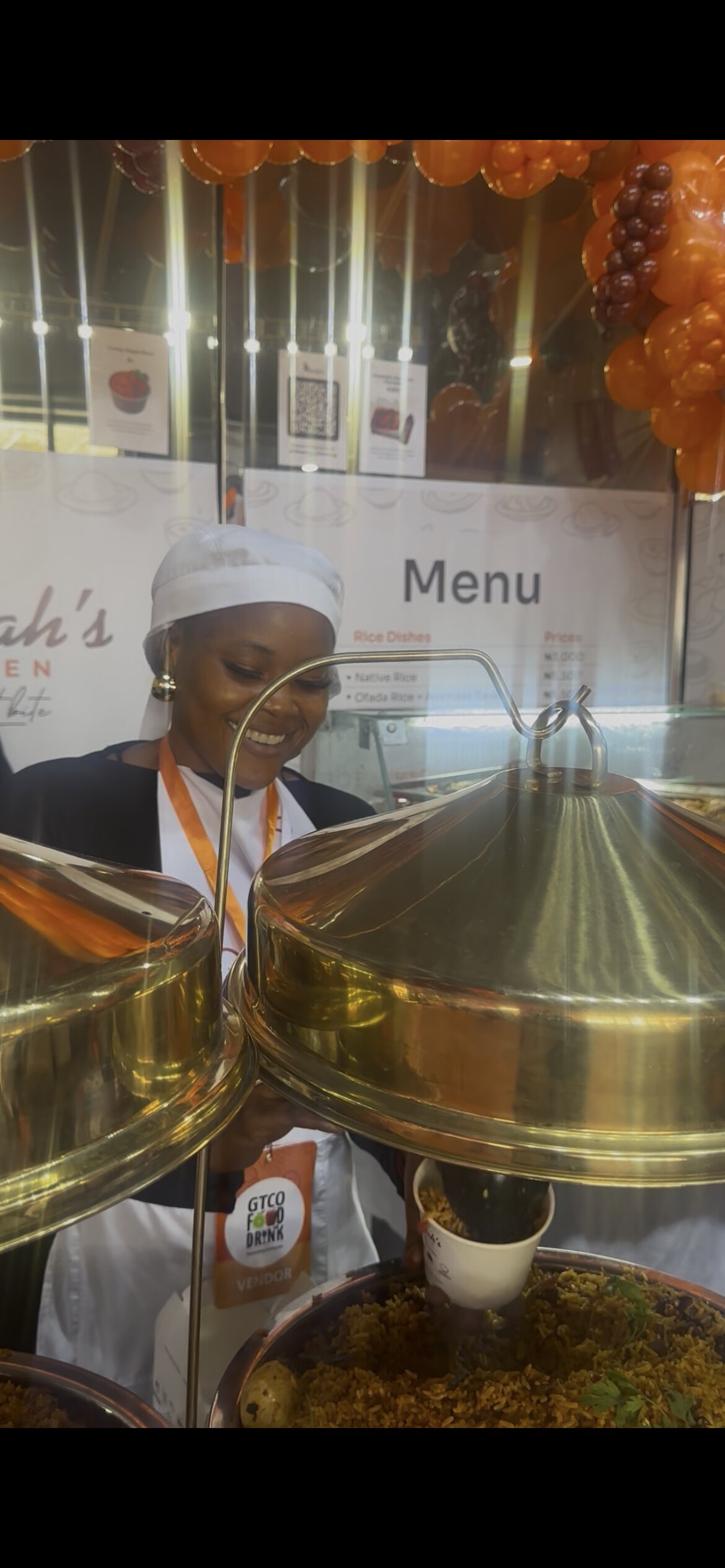 Rita behind the serving pots